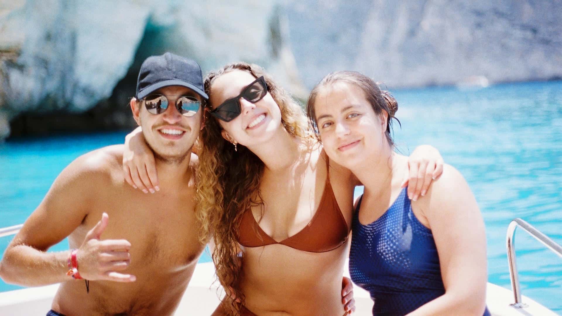 Well Groomed Man on a Boat with Two Women