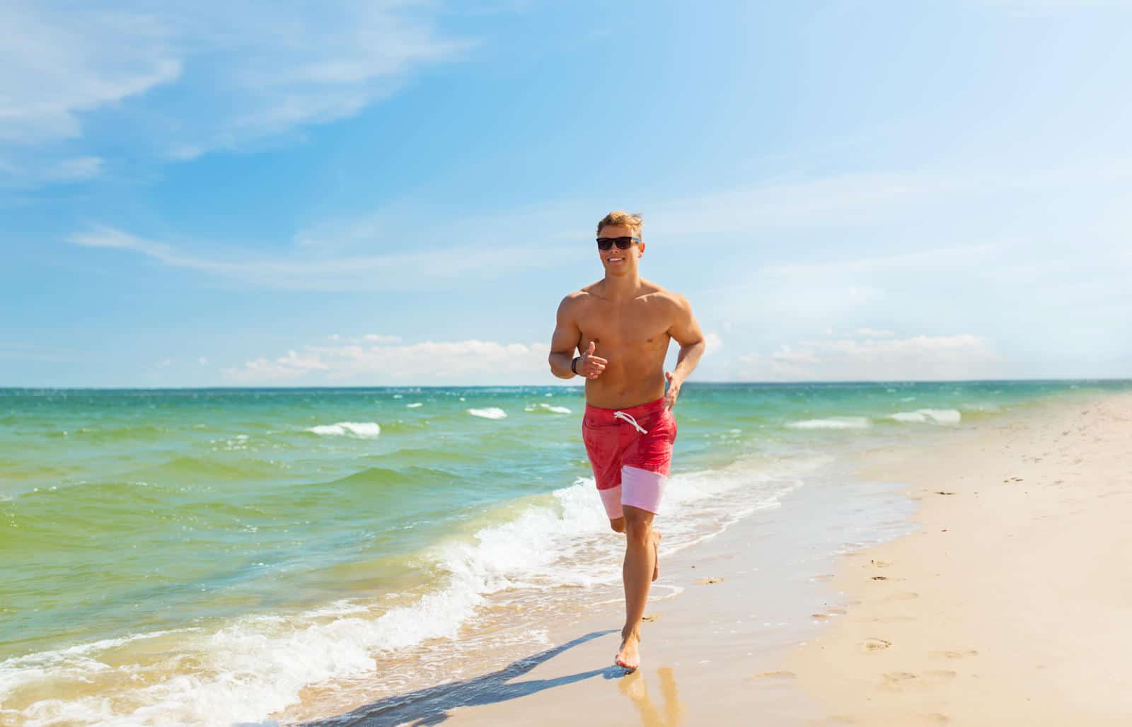 Man Running on the Beach After Trimming His Balls